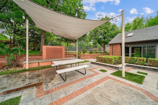 3219 S Birmingham Ave, Tulsa, OK 74105 - view of community with a patio area, fence, and outdoor dining area