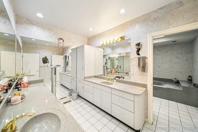 3219 S Birmingham Ave, Tulsa, OK 74105 - bathroom with wallpapered walls, tile patterned floors, two vanities, recessed lighting, and walk in shower