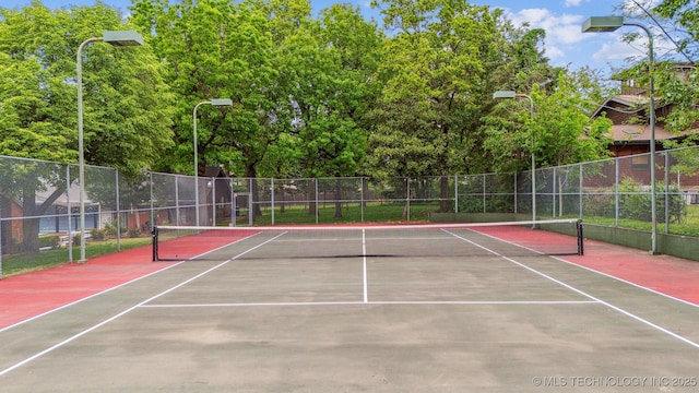 3219 S Birmingham Ave, Tulsa, OK 74105 - view of tennis court with fence and community basketball court