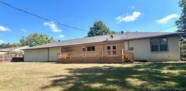 711 N SW, Ardmore, OK 73401 - back of property featuring a wooden deck and stucco siding