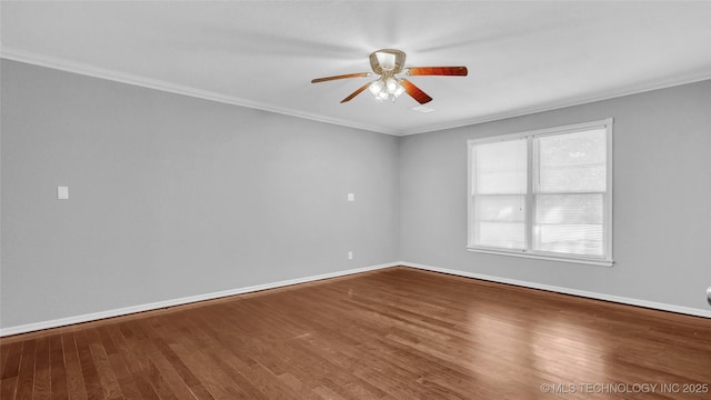 711 N SW, Ardmore, OK 73401 - spare room with a ceiling fan, baseboards, wood finished floors, and crown molding