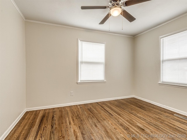 unfurnished room featuring crown molding, wood finished floors, baseboards, and a ceiling fan
