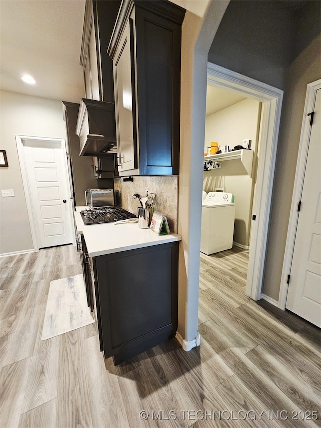 2721 S 8th St E, Broken Arrow, OK 74012 - kitchen featuring light wood-style flooring, backsplash, recessed lighting, light countertops, and custom range hood