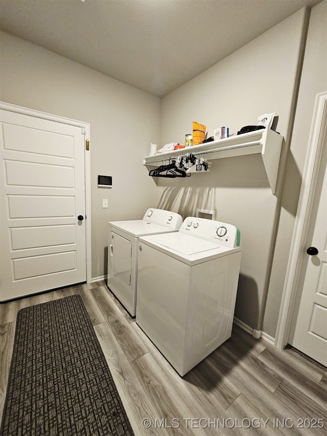 2721 S 8th St E, Broken Arrow, OK 74012 - washroom featuring washer and dryer and wood finished floors
