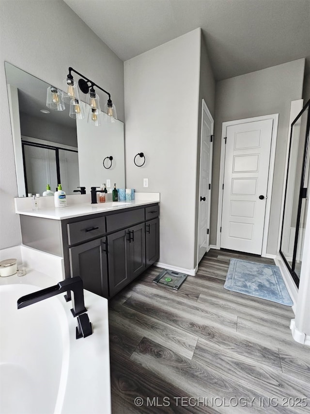 2721 S 8th St E, Broken Arrow, OK 74012 - full bathroom with vanity, wood finished floors, and a stall shower