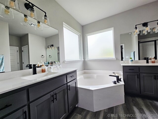 2721 S 8th St E, Broken Arrow, OK 74012 - full bathroom with wood finished floors, a garden tub, and two vanities