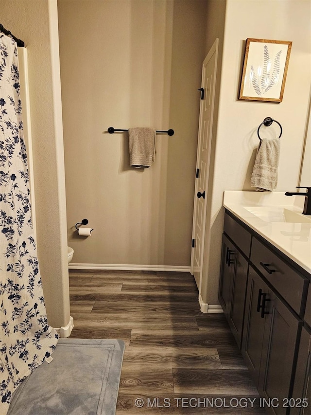 2721 S 8th St E, Broken Arrow, OK 74012 - full bath with wood finished floors, vanity, and a shower with curtain
