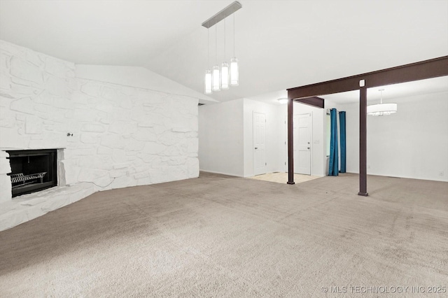 3719 E 84th St, Tulsa, OK 74137 - unfurnished living room with carpet, vaulted ceiling, and a fireplace