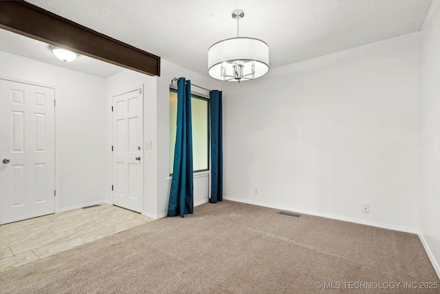 3719 E 84th St, Tulsa, OK 74137 - carpeted empty room featuring baseboards and a textured ceiling