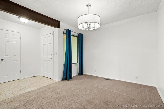 3719 E 84th St, Tulsa, OK 74137 - spare room featuring carpet, baseboards, and a textured ceiling