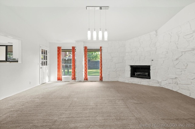 3719 E 84th St, Tulsa, OK 74137 - unfurnished living room with vaulted ceiling, carpet floors, and a stone fireplace