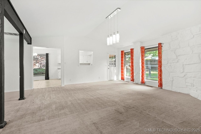 3719 E 84th St, Tulsa, OK 74137 - unfurnished living room with carpet, healthy amount of natural light, and vaulted ceiling