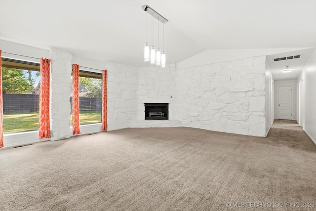 3719 E 84th St, Tulsa, OK 74137 - unfurnished living room featuring carpet flooring, lofted ceiling, and a stone fireplace