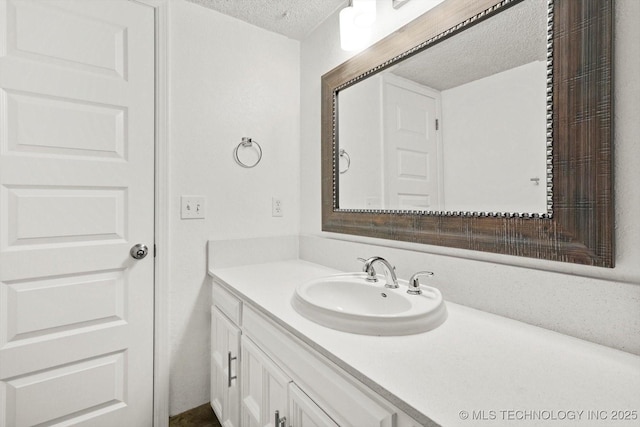 3719 E 84th St, Tulsa, OK 74137 - bathroom featuring a textured ceiling and vanity