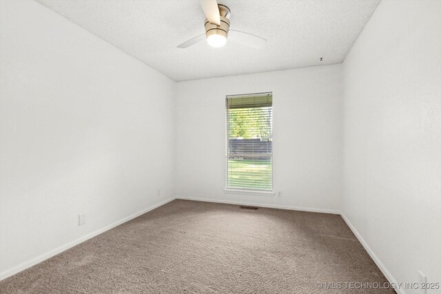 3719 E 84th St, Tulsa, OK 74137 - spare room with carpet, baseboards, ceiling fan, and a textured ceiling
