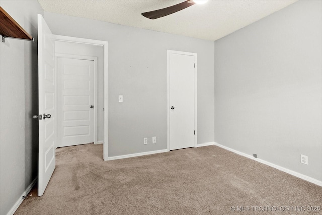 3719 E 84th St, Tulsa, OK 74137 - unfurnished bedroom with carpet flooring, baseboards, a textured ceiling, and a ceiling fan