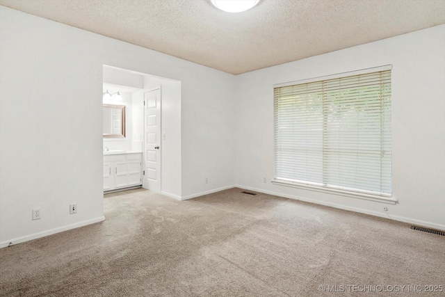 3719 E 84th St, Tulsa, OK 74137 - empty room with carpet, a textured ceiling, and baseboards