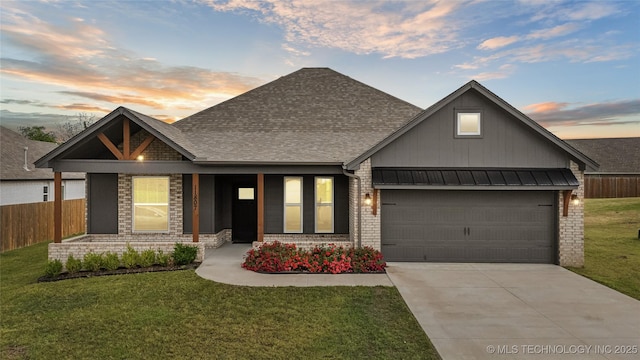 11807 N 131st E Ave, Owasso, OK 74055 - view of front of property featuring board and batten siding, brick siding, a garage, roof with shingles, and driveway