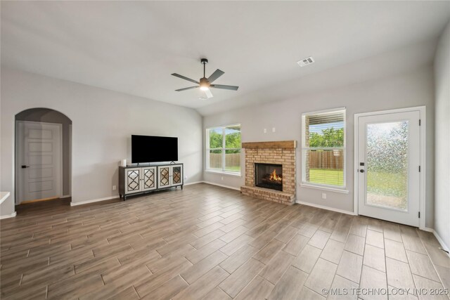 11807 N 131st E Ave, Owasso, OK 74055 - unfurnished living room with ceiling fan, arched walkways, and baseboards