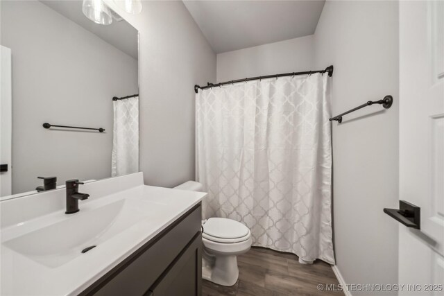 11807 N 131st E Ave, Owasso, OK 74055 - full bathroom with vanity, wood finished floors, toilet, and a shower with curtain