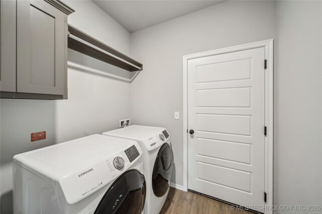 11807 N 131st E Ave, Owasso, OK 74055 - washroom with washer and clothes dryer, wood finished floors, cabinet space, and baseboards