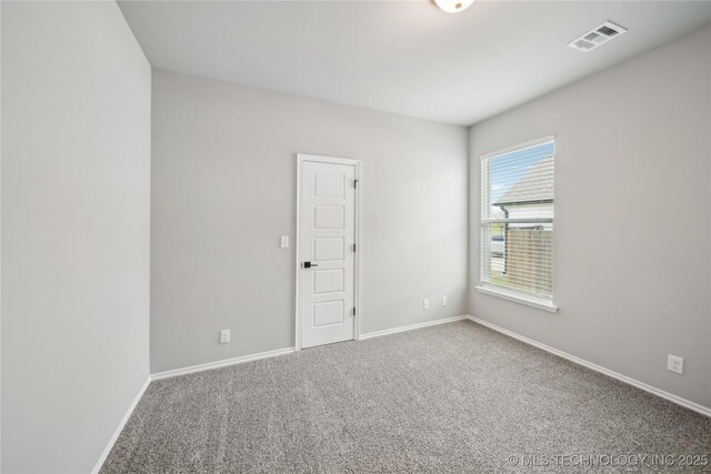 11807 N 131st E Ave, Owasso, OK 74055 - spare room featuring carpet and baseboards