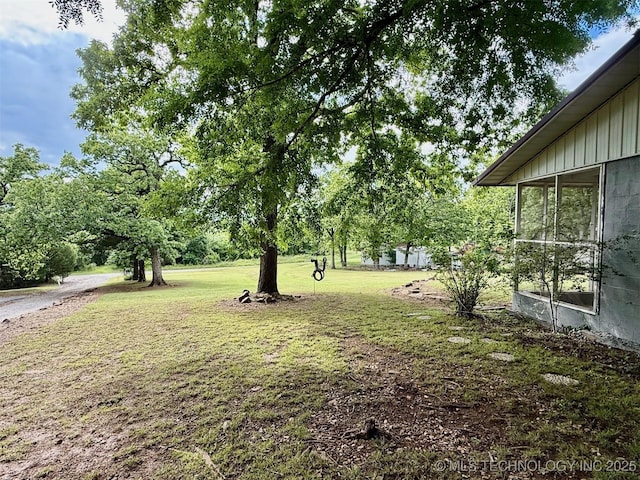 19442 W 929, Cookson, OK 74427 - view of green lawn featuring a sunroom