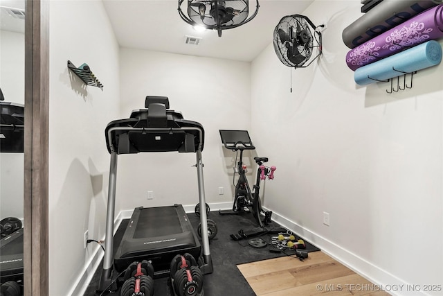 exercise room with baseboards