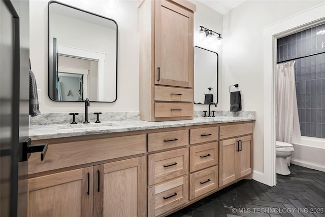 full bath with double vanity, toilet, and shower / bath combo