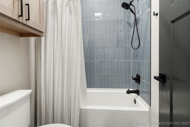 bathroom featuring shower / bath combination with curtain and toilet
