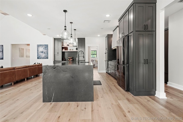 kitchen with light wood-style flooring, open shelves, baseboards, decorative light fixtures, and recessed lighting