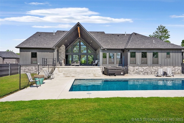 view of pool featuring a hot tub and a patio area