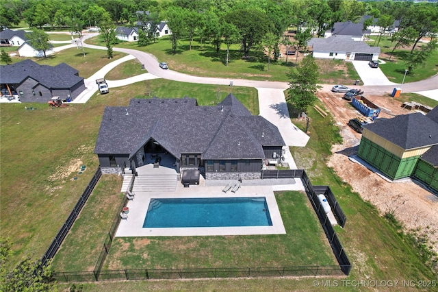 aerial perspective of suburban area featuring a pool area