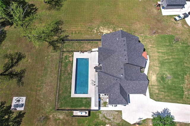 view from above of property featuring a pool area