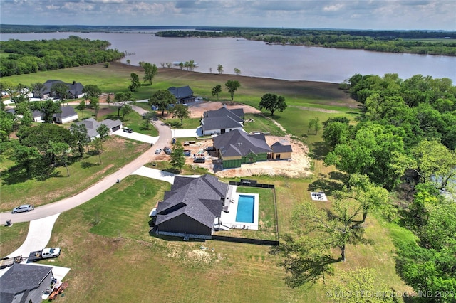 view of property location featuring a large body of water and a pool area