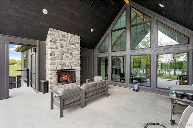 sunroom / solarium featuring lofted ceiling