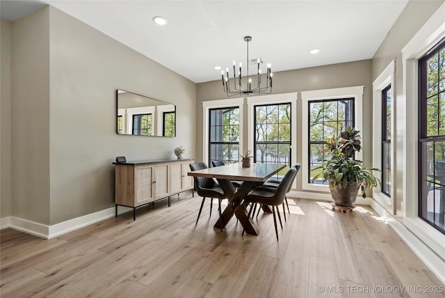 dining room featuring a chandelier, light wood-style flooring, baseboards, and recessed lighting