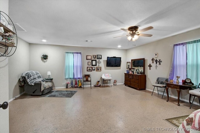 10627 Old Willis, Kingston, OK 73439 - living area featuring speckle patterned floor, a ceiling fan, baseboards, and recessed lighting