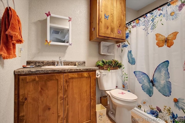 10627 Old Willis, Kingston, OK 73439 - bathroom featuring vanity, toilet, curtained shower, and a textured wall