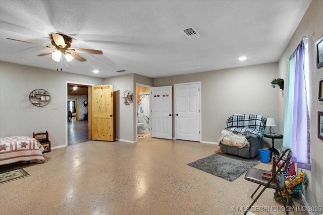 10627 Old Willis, Kingston, OK 73439 - living area with a ceiling fan, baseboards, speckle patterned floor, and recessed lighting