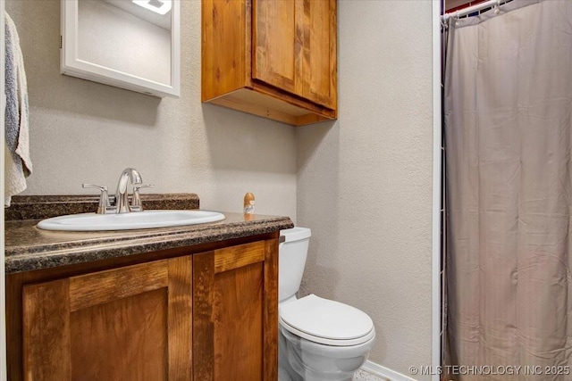 10627 Old Willis, Kingston, OK 73439 - bathroom with a textured wall, toilet, vanity, and curtained shower