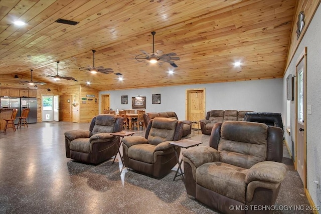 10627 Old Willis, Kingston, OK 73439 - home theater room featuring a ceiling fan, lofted ceiling, wooden ceiling, wooden walls, and speckled floor