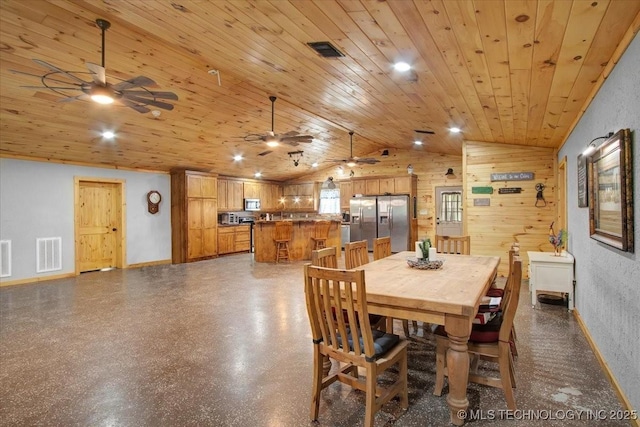 10627 Old Willis, Kingston, OK 73439 - dining space with a ceiling fan, vaulted ceiling, wooden ceiling, baseboards, and wooden walls