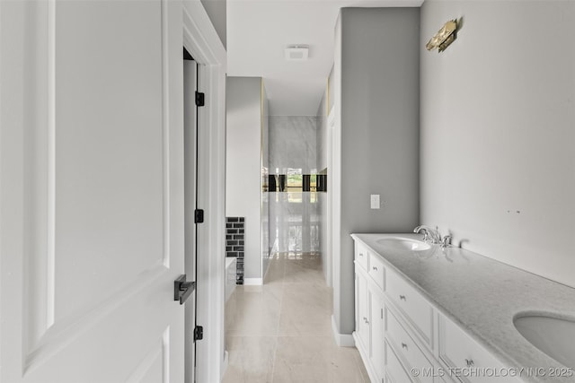 bathroom featuring tile patterned floors and double vanity