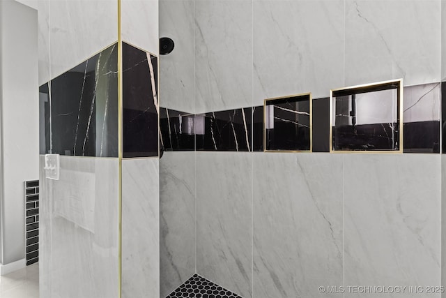 interior space featuring tiled shower