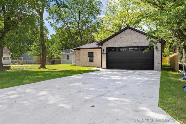 ranch-style house featuring a garage, concrete driveway, and brick siding
