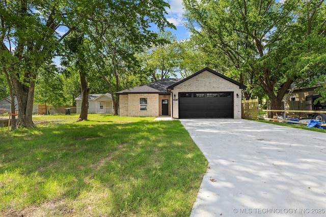 view of front of house featuring a garage, driveway, and brick siding