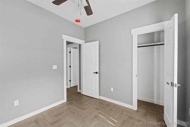 unfurnished bedroom with baseboards, a closet, and ceiling fan