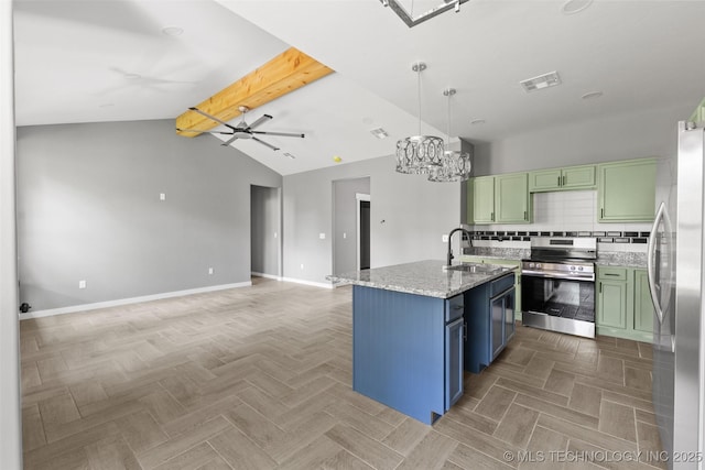 kitchen featuring appliances with stainless steel finishes, green cabinetry, a sink, and baseboards