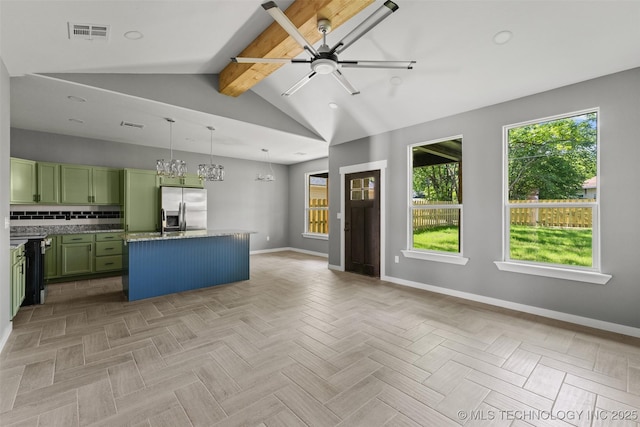 kitchen with green cabinetry, stainless steel refrigerator with ice dispenser, baseboards, ceiling fan, and tasteful backsplash
